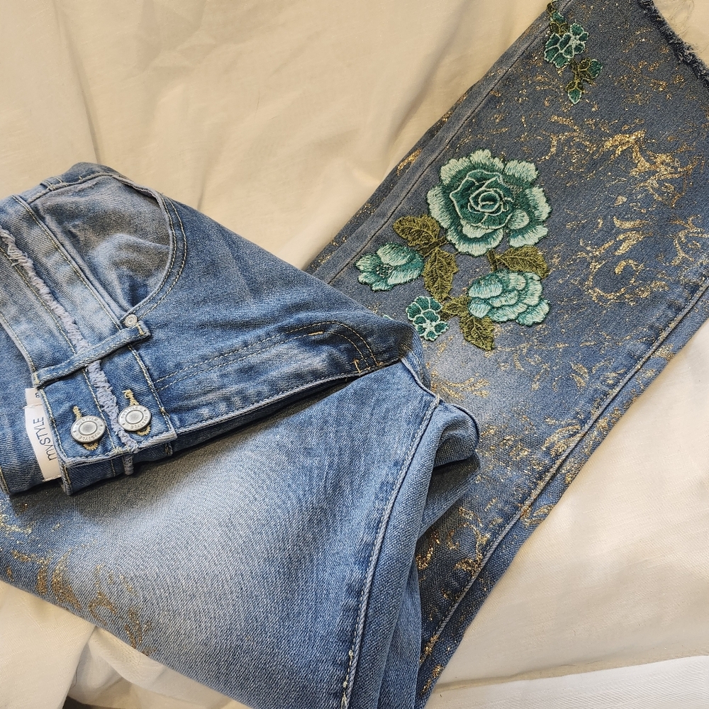 Upclycled Distressed Blue Jeans With Gold Accents And Floral Appliques